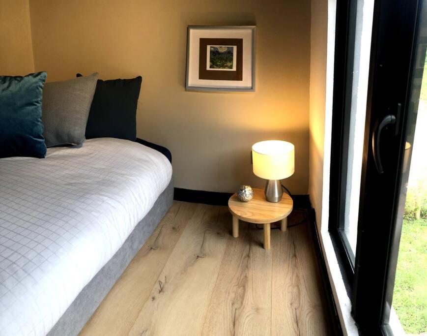 Postel nebo postele na pokoji v ubytování Luxury Glamping - Tiny House al natural