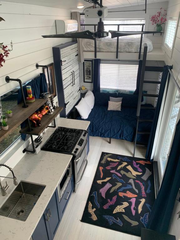 an aerial view of a kitchen and living room in a tiny house at Modern, pet friendly tiny house, No extra fees! in Clermont