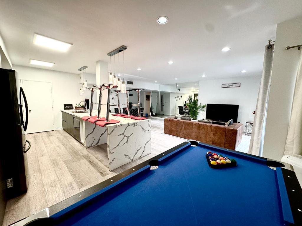 a living room with a pool table in a room at Amazing Large 2 Bedroom West Hollywood Apartment in Los Angeles