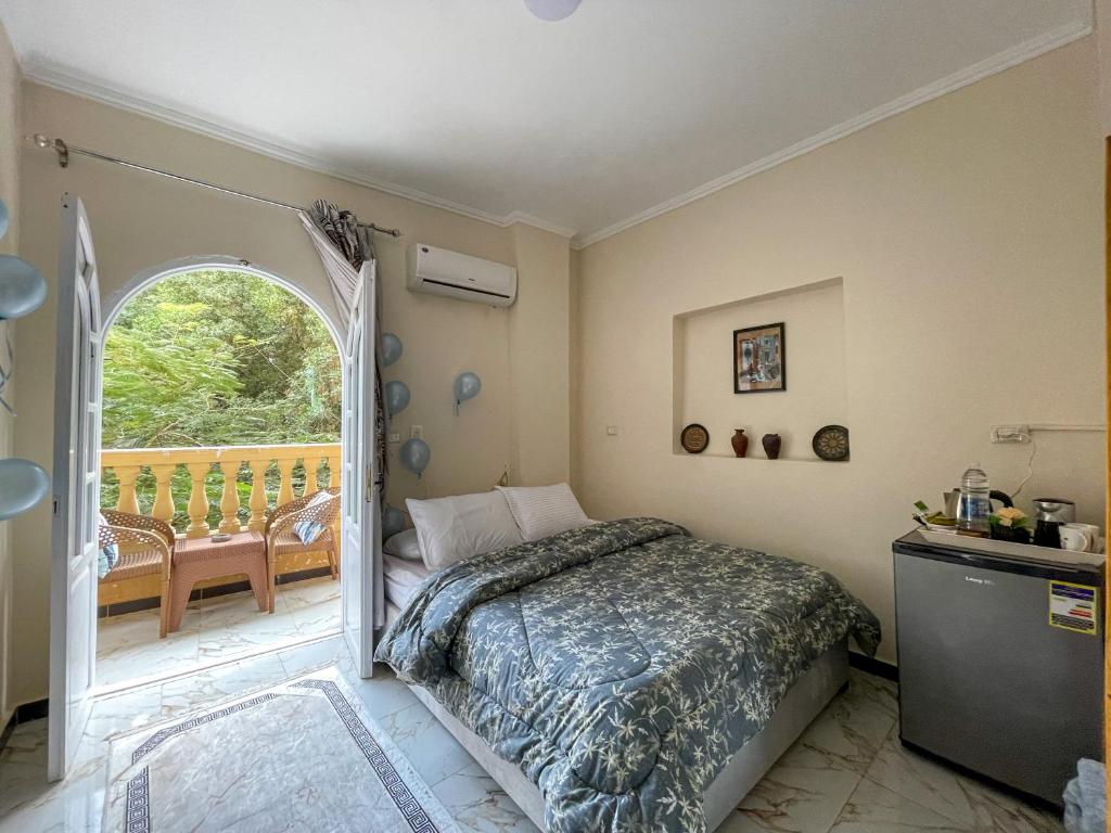 Postel nebo postele na pokoji v ubytování Chez l'ami hotel