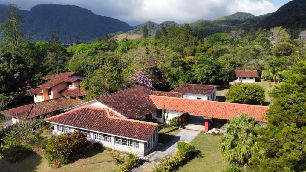 an aerial view of a house with mountains in the background at Casa Naturaleza in Valle de Anton