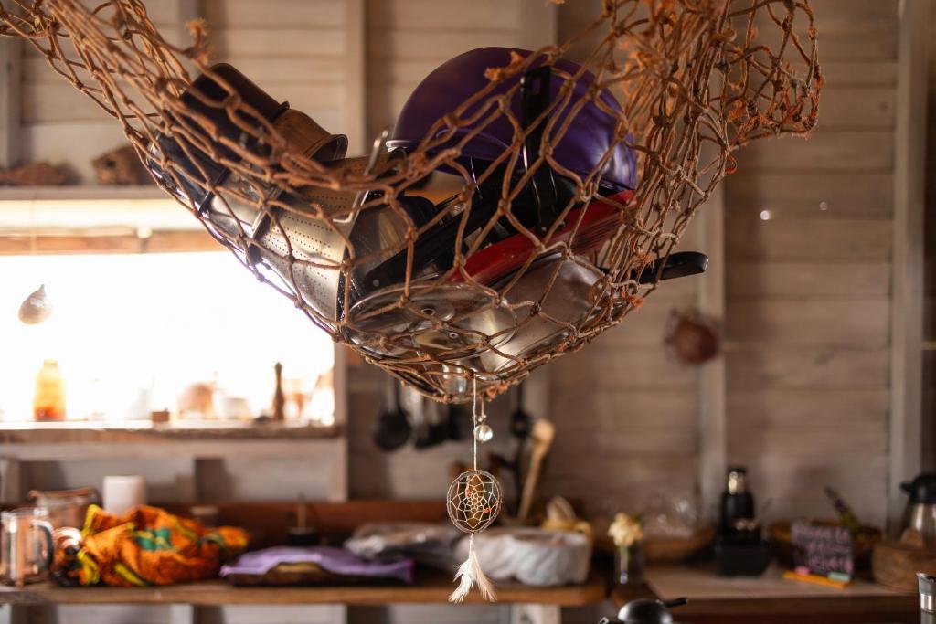 a basket filled with dishes on top of a table at Casa Satori in Barra de Valizas