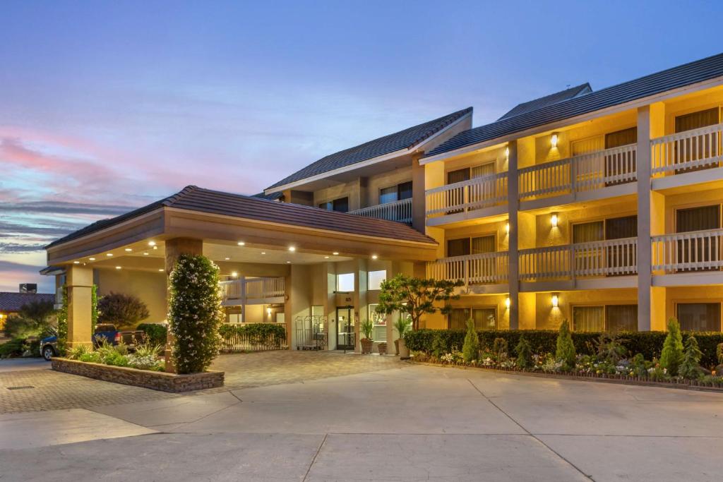 an exterior view of a building at dusk at Best Western Plus Monterey Inn in Monterey