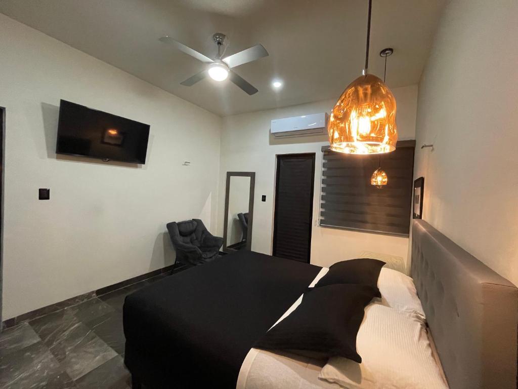 Postel nebo postele na pokoji v ubytování Hotel Suites La Negra