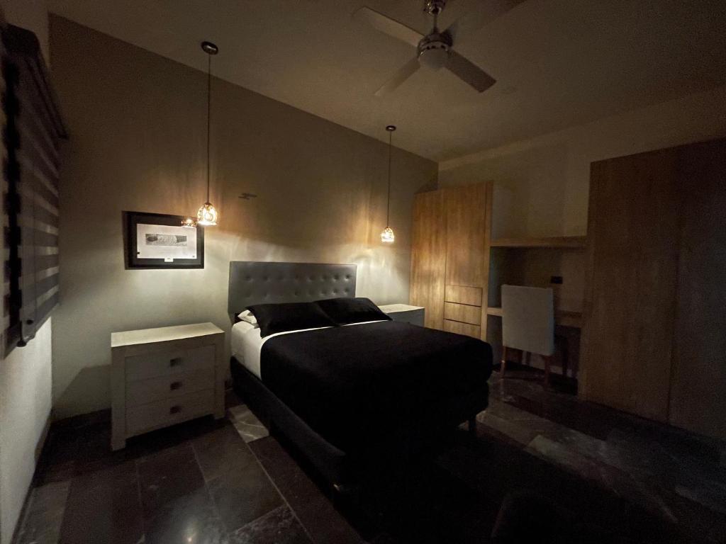 Postel nebo postele na pokoji v ubytování Hotel Suites La Negra