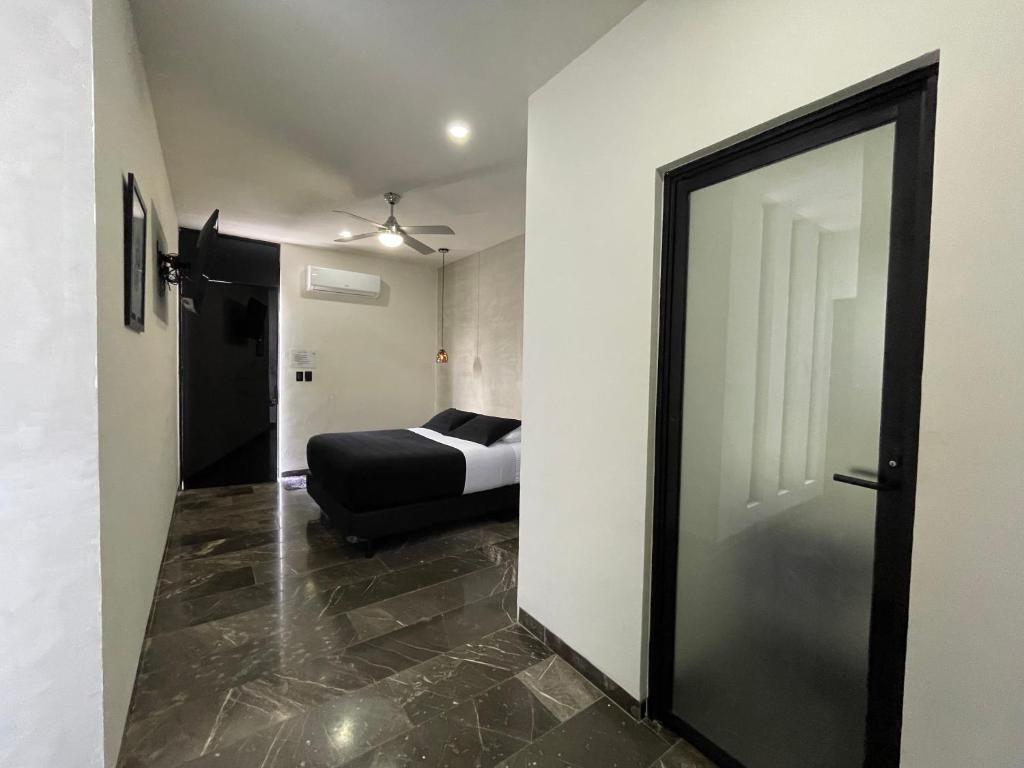 Postel nebo postele na pokoji v ubytování Hotel Suites La Negra