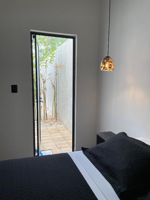 Postel nebo postele na pokoji v ubytování Hotel Suites La Negra