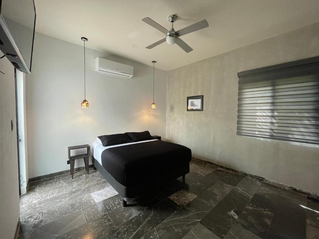 Postel nebo postele na pokoji v ubytování Hotel Suites La Negra