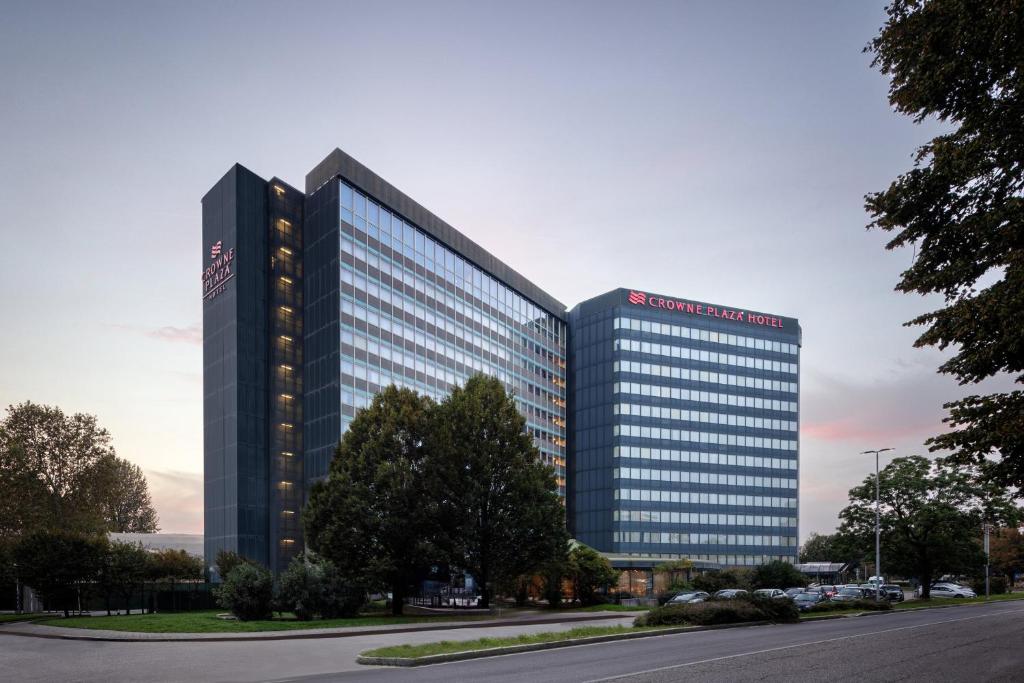a tall building with a lot of windows at Crowne Plaza Milan Linate by IHG in San Donato Milanese
