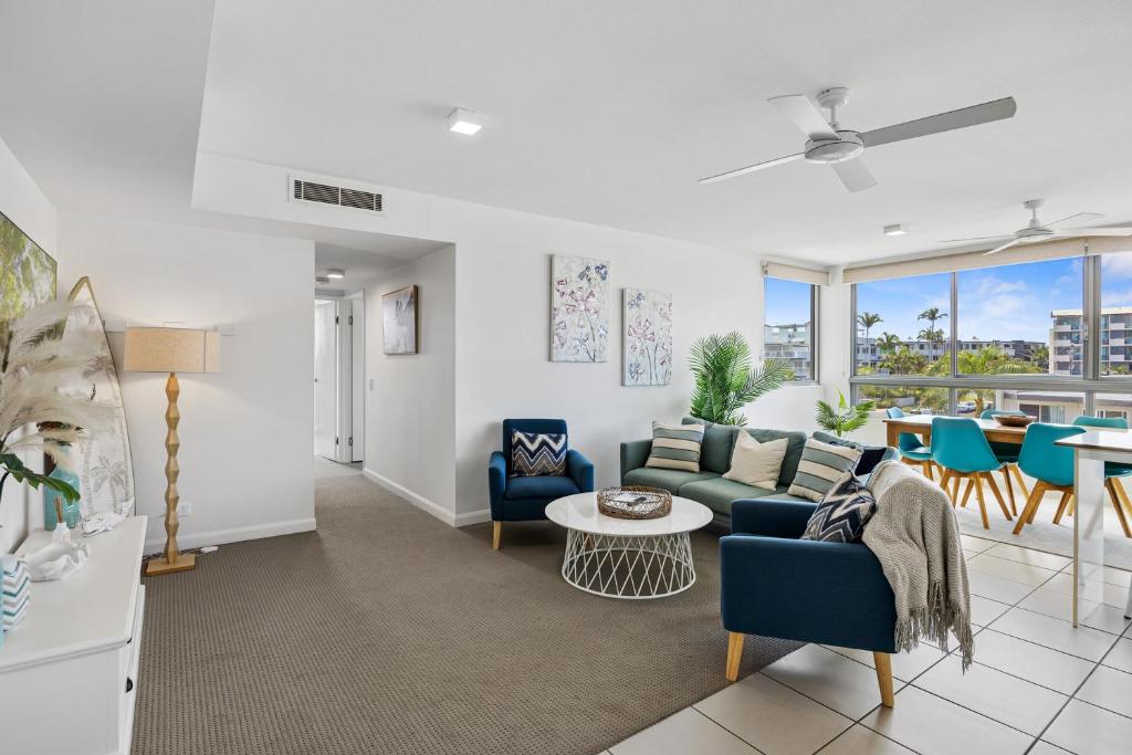 a living room with a couch and a table at Nova Mooloolaba Beach Apartments in Mooloolaba