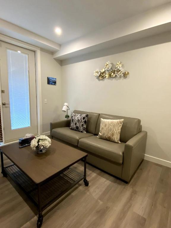 a living room with a couch and a coffee table at Luxury unit in the heart of Canmore in Canmore