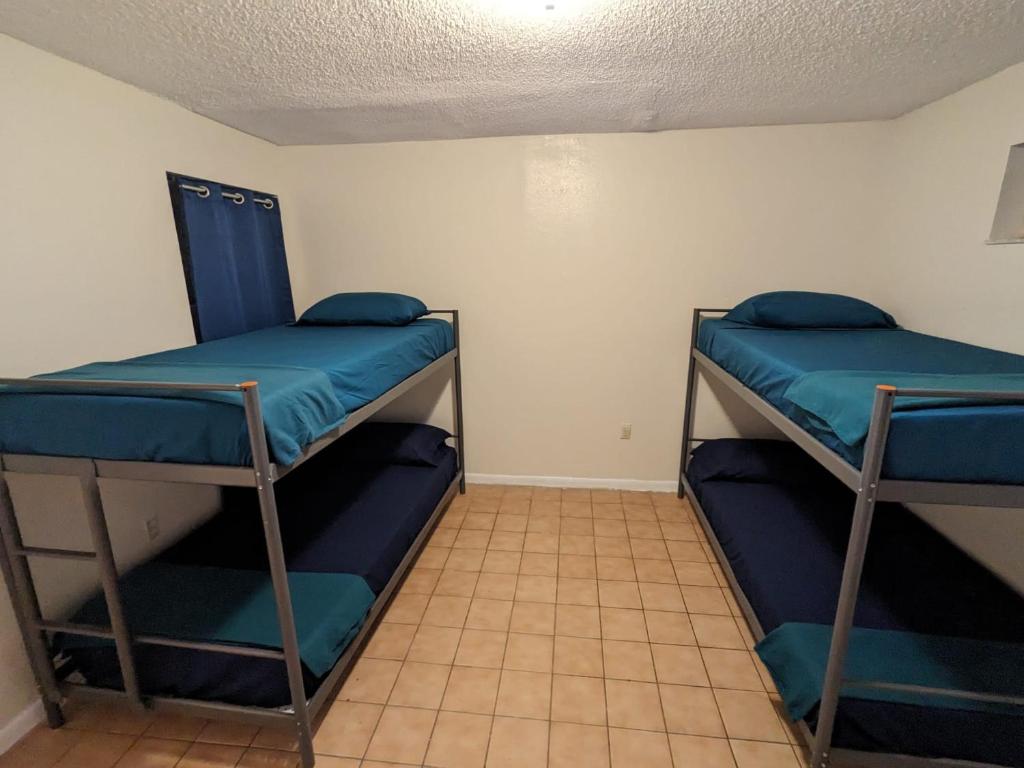 Postel nebo postele na pokoji v ubytování Hospedaje North Miami