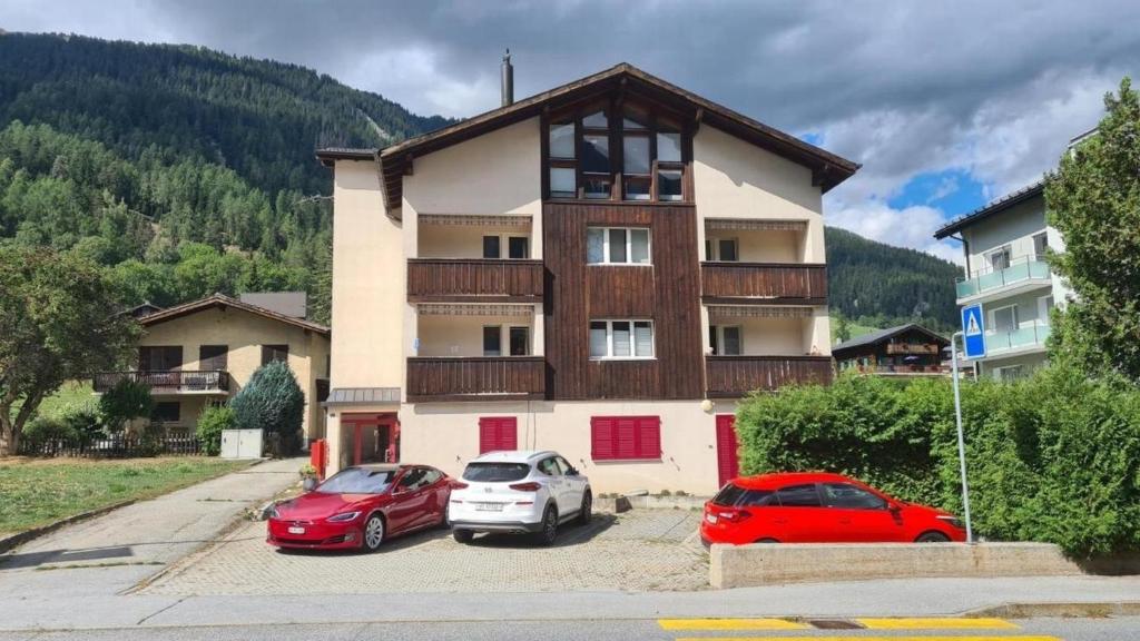 two cars parked in a parking lot in front of a building at Chalet Lavendel - b48868 in Lax