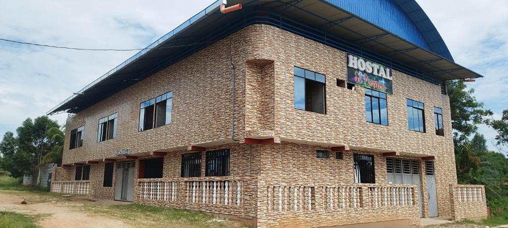 a brick building with a sign on the side of it at PARAISO in Puerto Callao