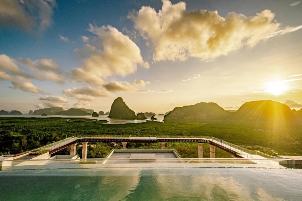 a view of the mountains from the infinity pool of a resort at Beyond Skywalk Nangshi in Ban Met Nang Chi