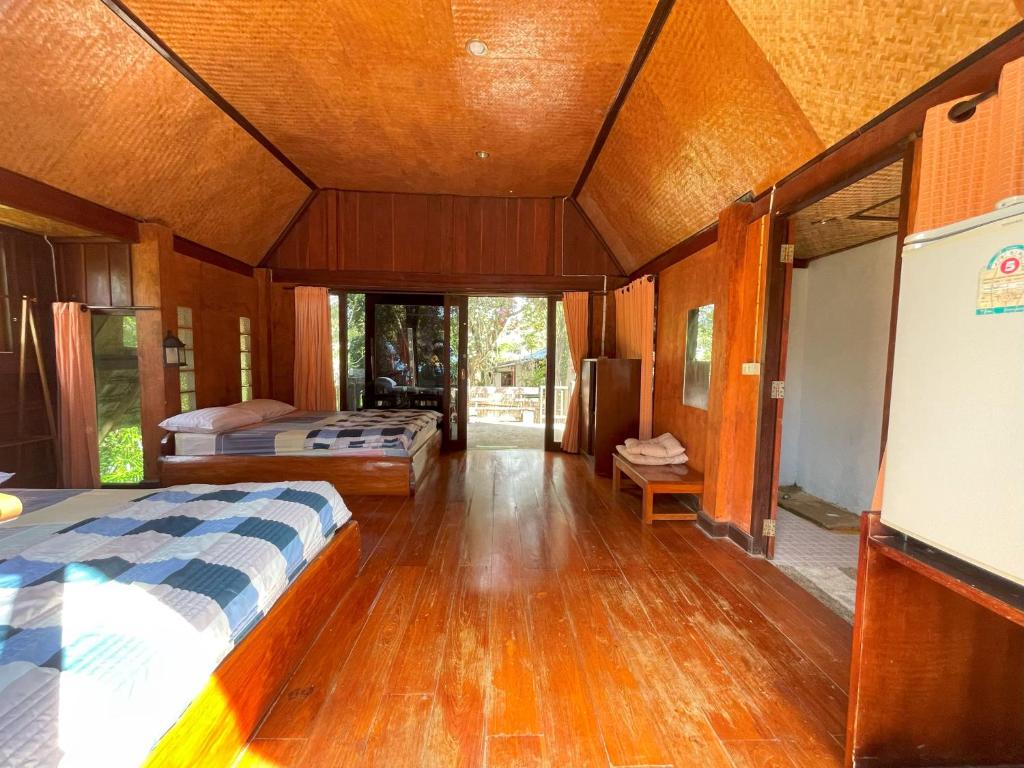 Postel nebo postele na pokoji v ubytování Pai Kiniman Resort
