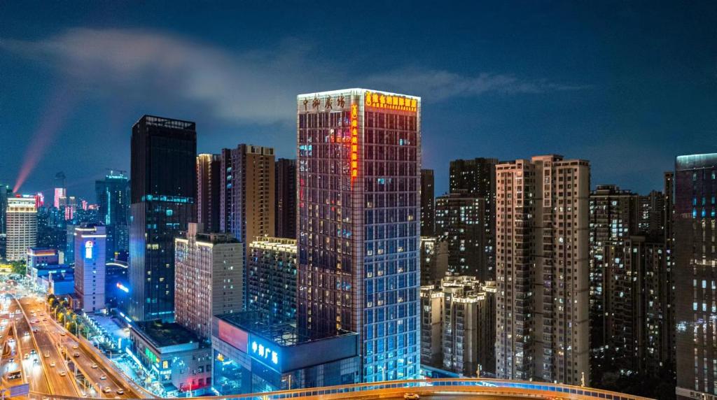 a view of a city at night with at Vienna International Hotel Wuhan Jiefang Avenue in Wuhan