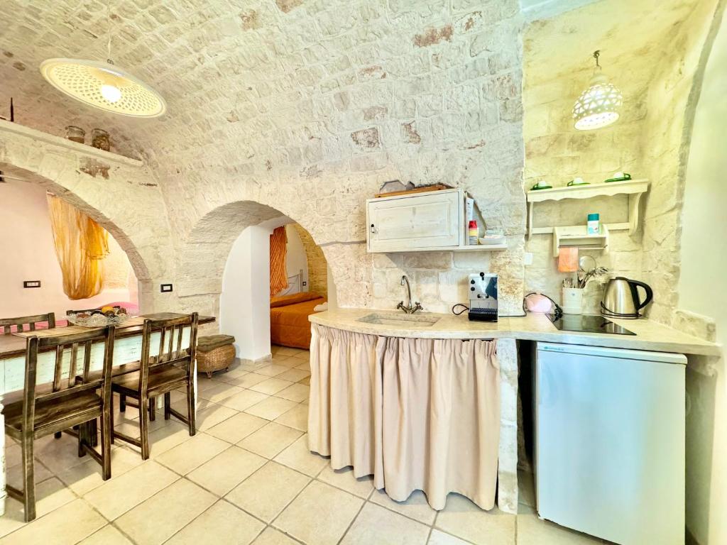 Kuchyň nebo kuchyňský kout v ubytování Trulli Moon