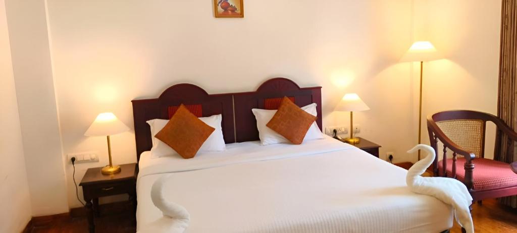 Postel nebo postele na pokoji v ubytování Hotel C7 Munnar