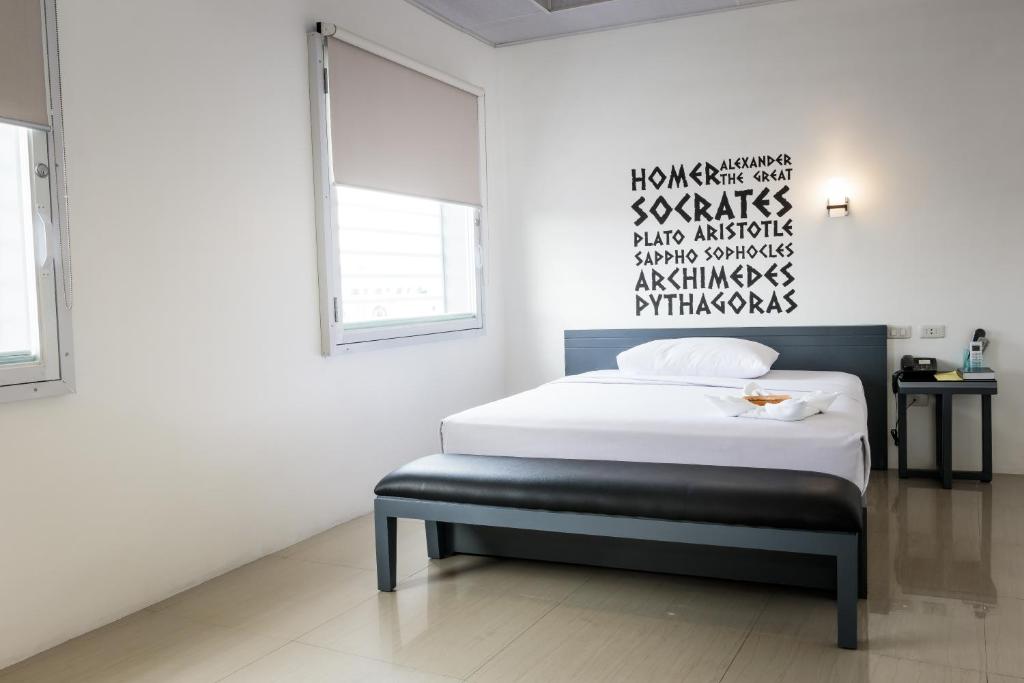 Postel nebo postele na pokoji v ubytování GC Suites