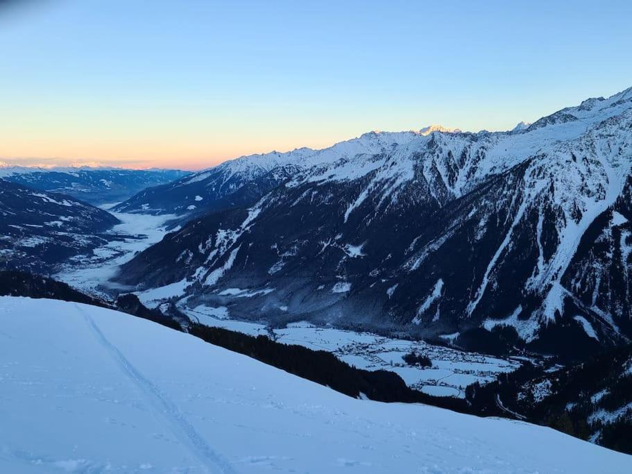 a view of a snow covered mountain with a valley at Zillertal-Arena 42m2 (2-6 persons: 2adults +4kids) in Krimml
