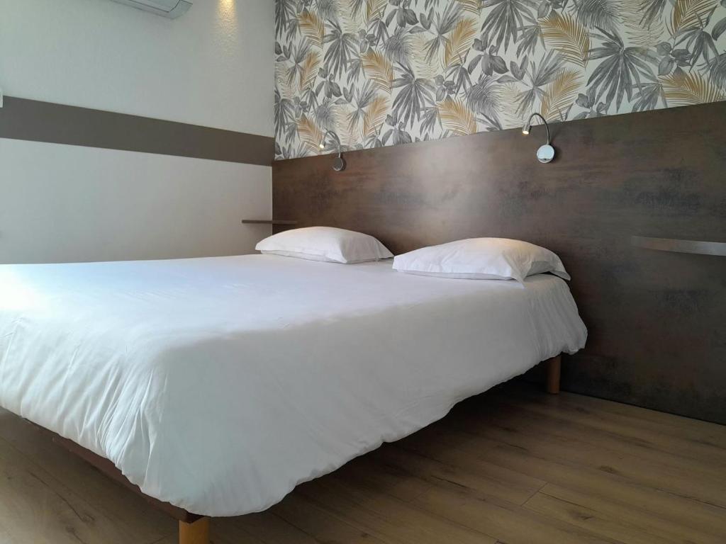 Postel nebo postele na pokoji v ubytování Fasthotel Narbonne