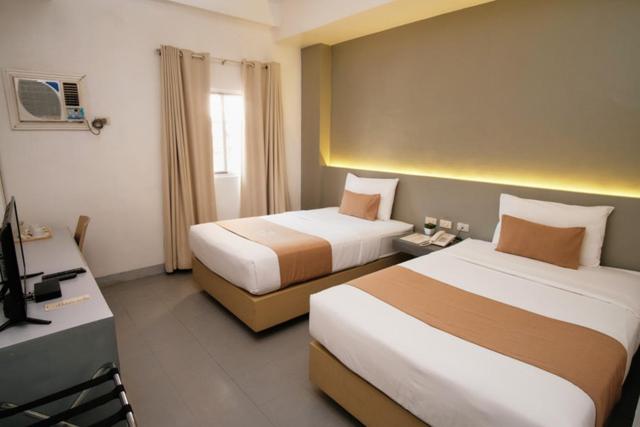 Postel nebo postele na pokoji v ubytování Casa Veles Hotel