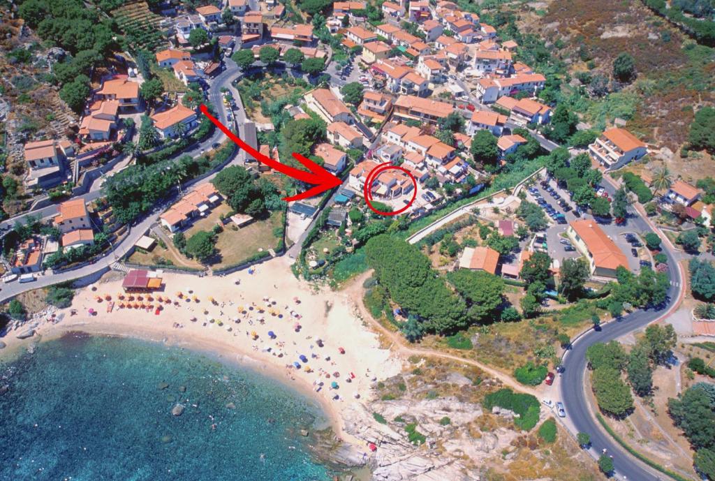 an aerial view of a beach with a red circle at Appartamenti Seccheto in Seccheto