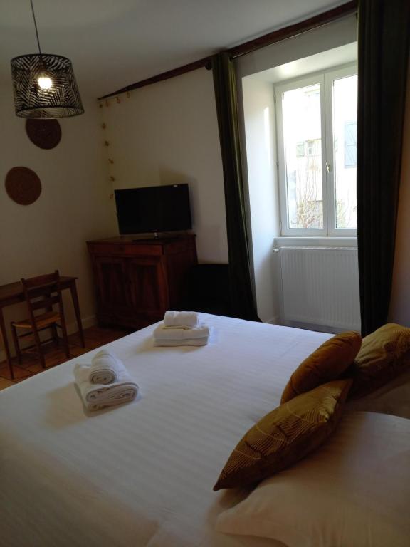 Postel nebo postele na pokoji v ubytování Hotel de la Halle