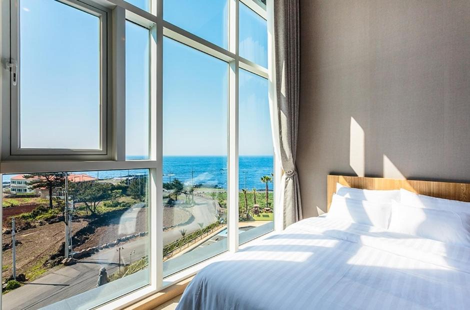 Postel nebo postele na pokoji v ubytování Rich Hotel