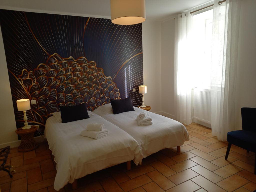Postel nebo postele na pokoji v ubytování Hotel de la Halle