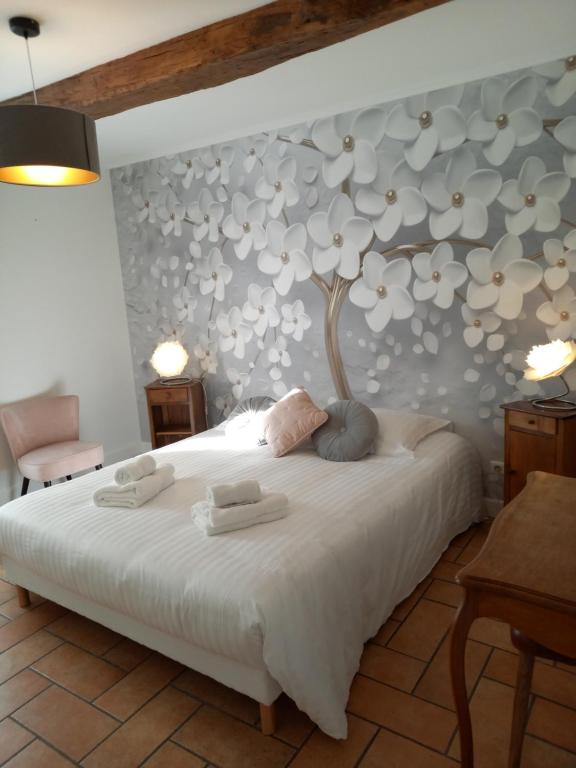 Postel nebo postele na pokoji v ubytování Hotel de la Halle