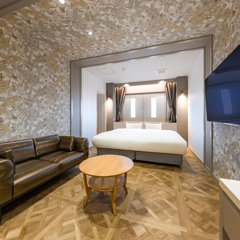 Postel nebo postele na pokoji v ubytování Hotel Noir Blanc