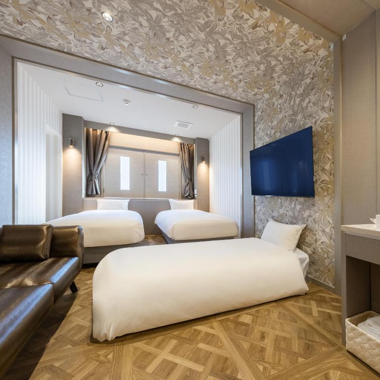 Postel nebo postele na pokoji v ubytování Hotel Noir Blanc