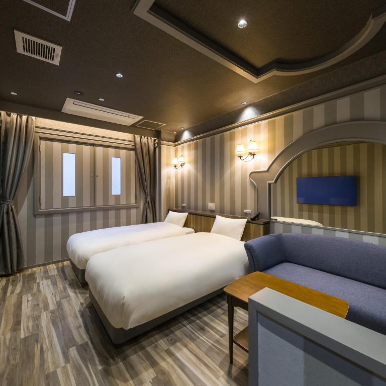 Postel nebo postele na pokoji v ubytování Hotel Noir Blanc
