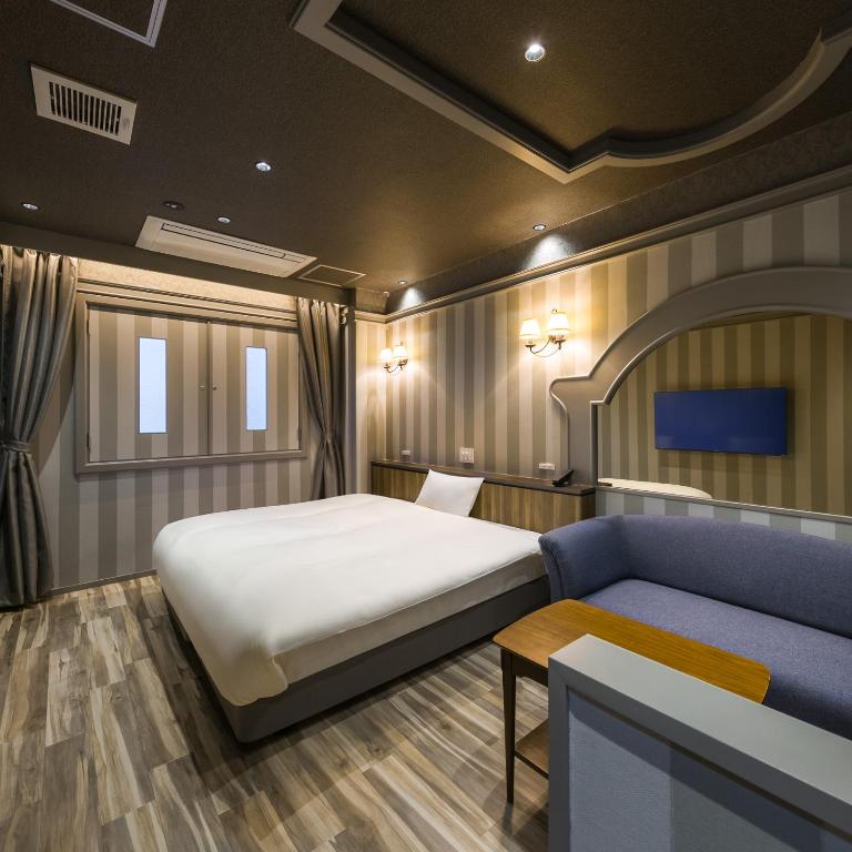 Postel nebo postele na pokoji v ubytování Hotel Noir Blanc