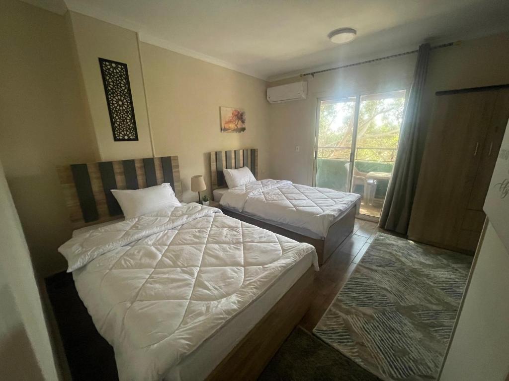 Voodi või voodid majutusasutuse Malek Pyramids Guest House toas