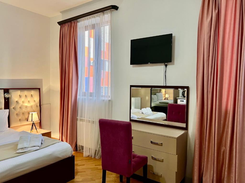 Voodi või voodid majutusasutuse Family Hotel toas
