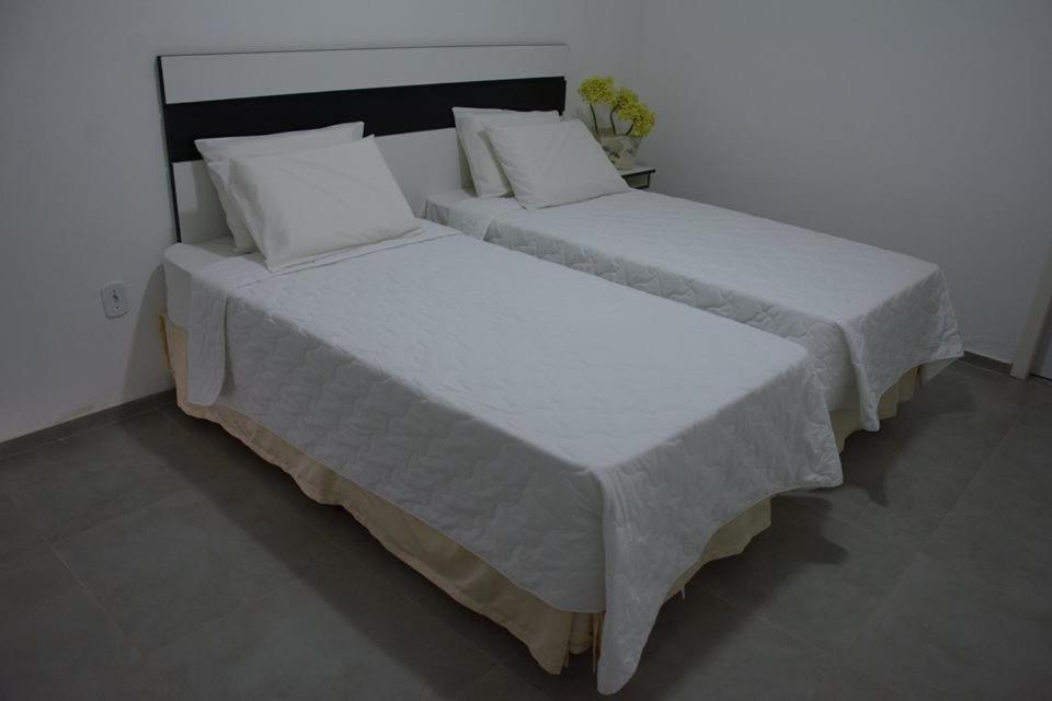 Postel nebo postele na pokoji v ubytování Hotel Caraipe