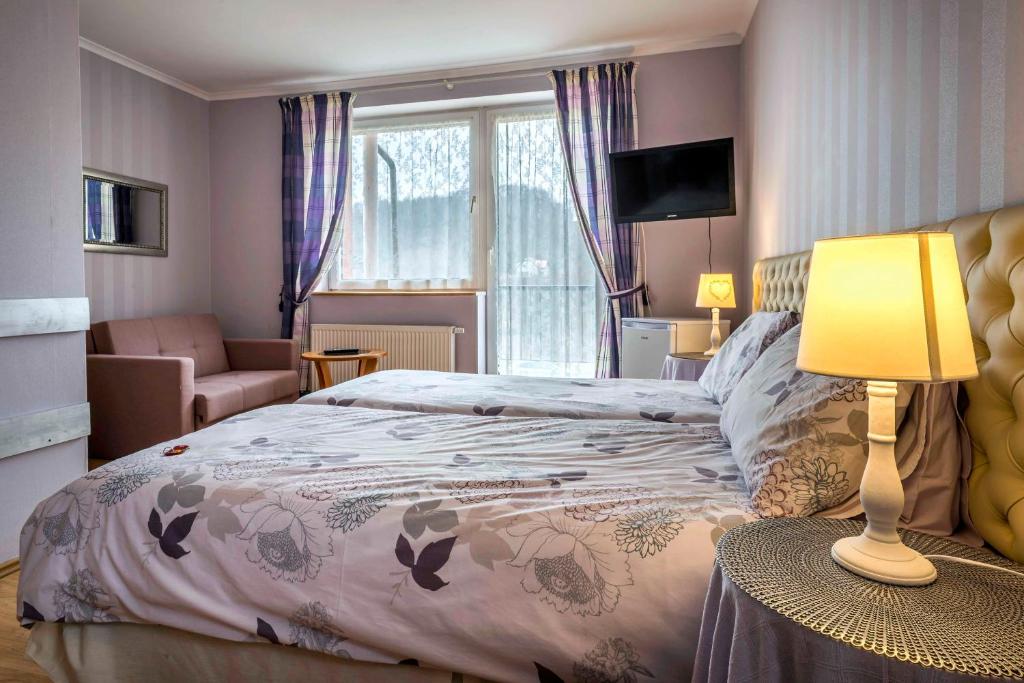 Postel nebo postele na pokoji v ubytování Pensjonat nad jeziorem Lakeside