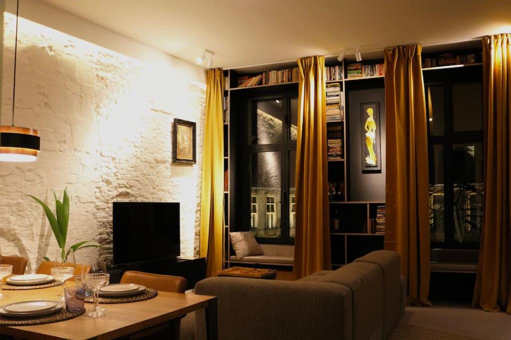 a living room with a couch and a table at The View in Antwerp