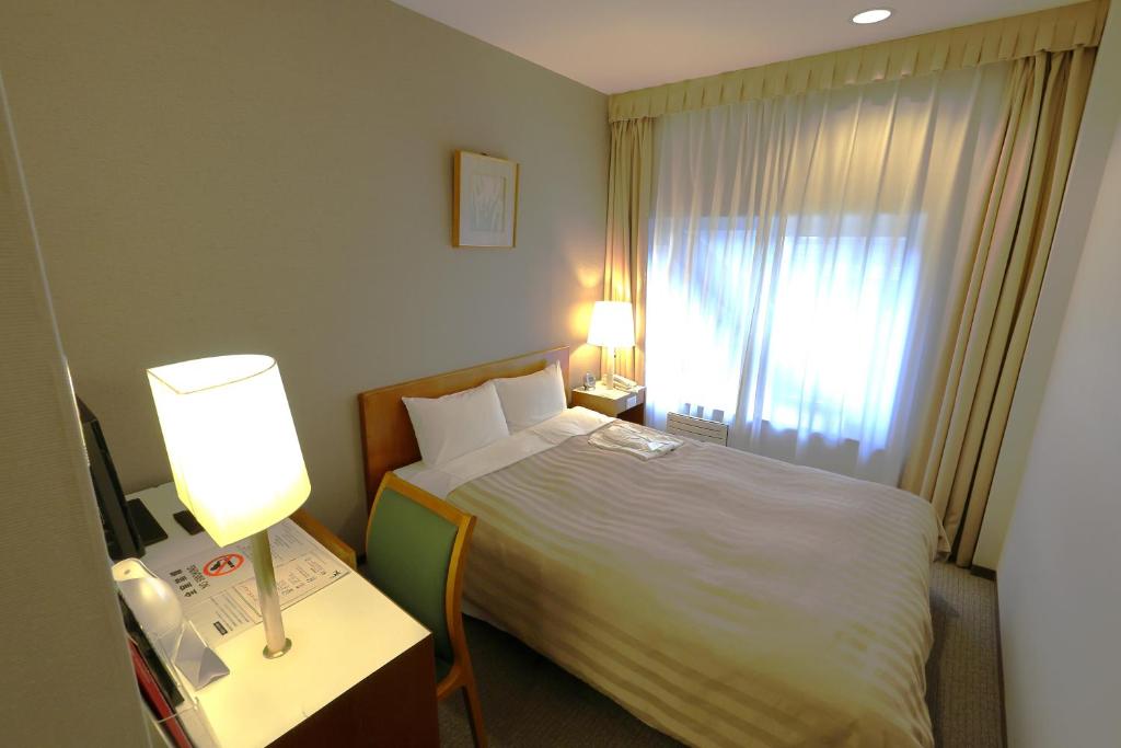 Postel nebo postele na pokoji v ubytování Hotel Gimmond Kyoto