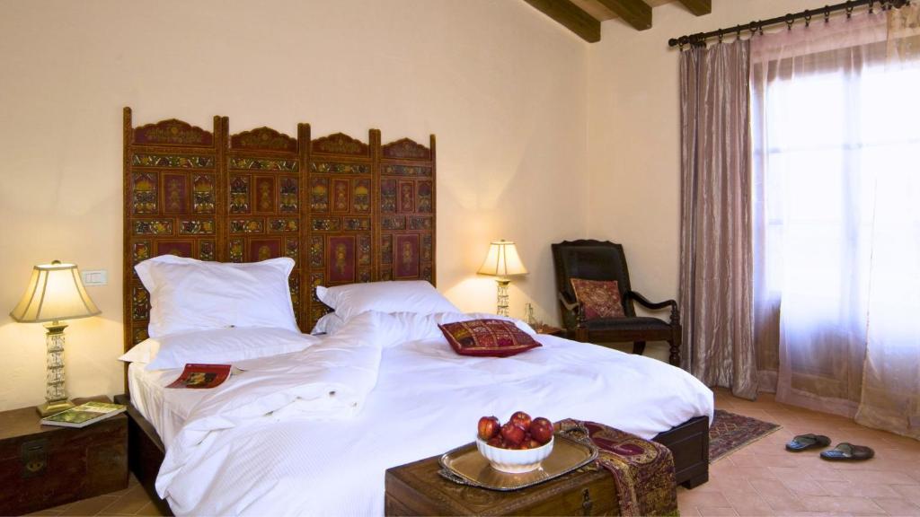 Postel nebo postele na pokoji v ubytování Hotel Podere Conti