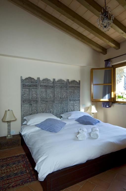 Postel nebo postele na pokoji v ubytování Hotel Podere Conti