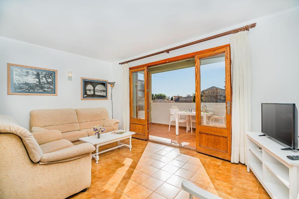 TV a/nebo společenská místnost v ubytování Apartamentos Bressol