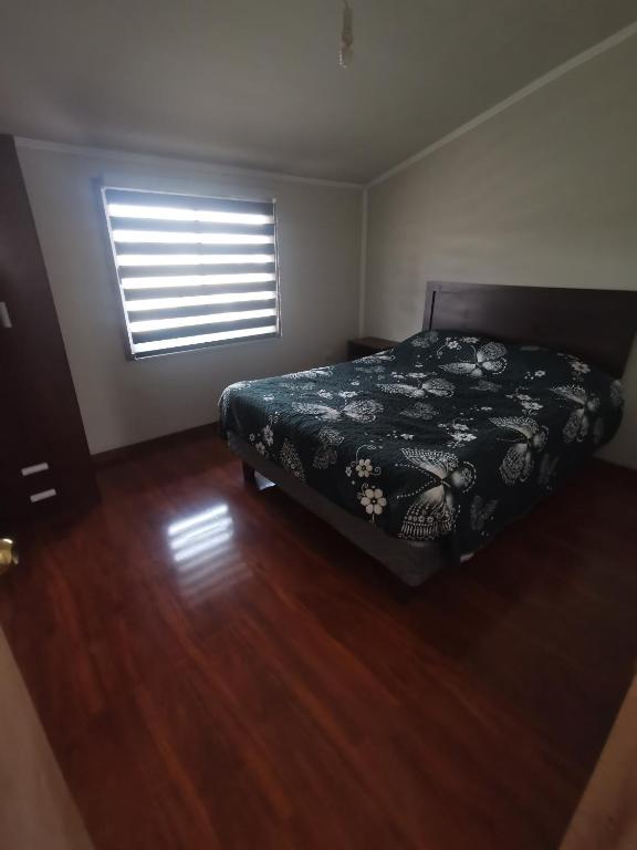 En eller flere senge i et værelse på ICARUMBI