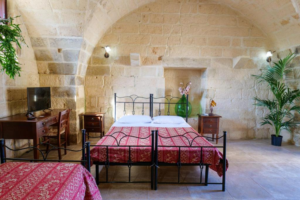 A bed or beds in a room at masseria Furca