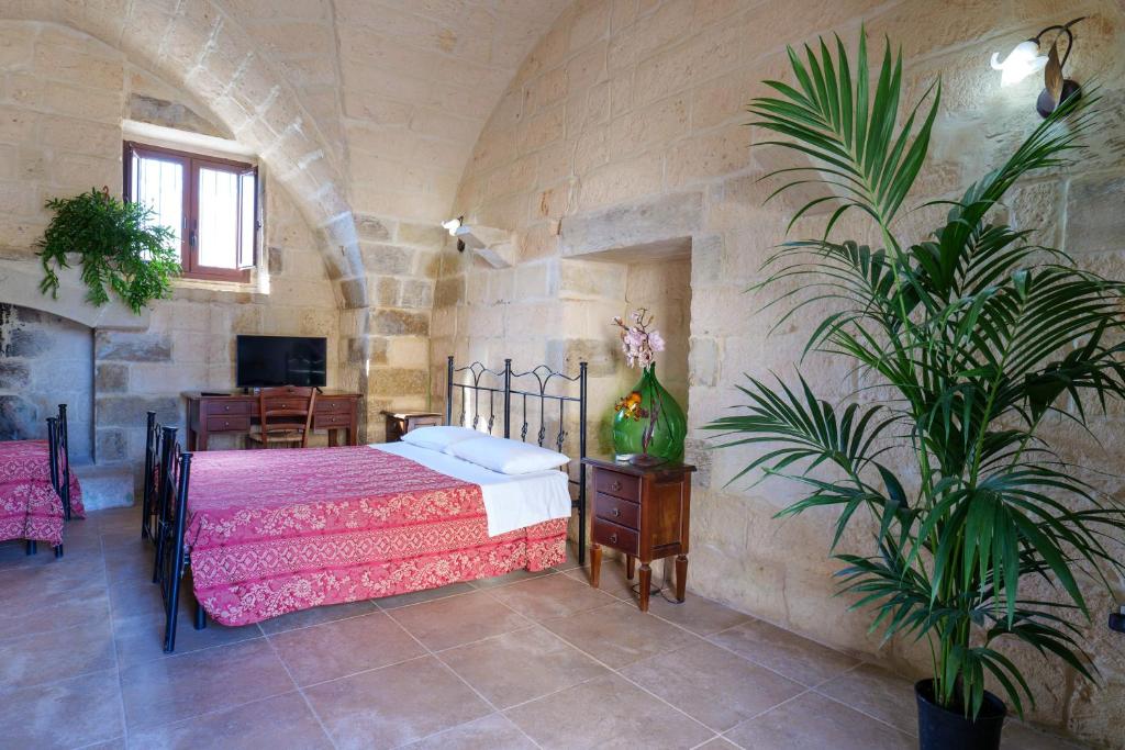 A bed or beds in a room at masseria Furca