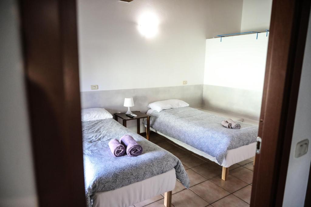 Postel nebo postele na pokoji v ubytování Piccinardi house - appartamento 4 posti letto