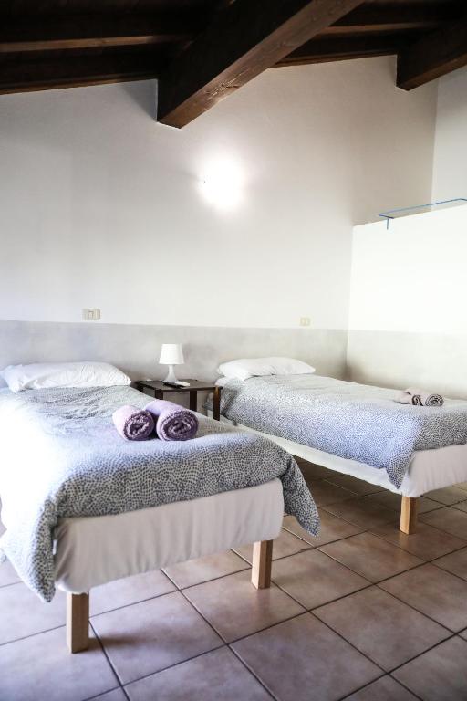 Postel nebo postele na pokoji v ubytování Piccinardi house - appartamento 4 posti letto